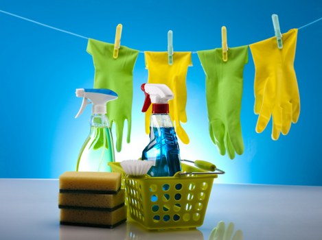 Cleaner wearing PPE while handling carpet cleaning equipment